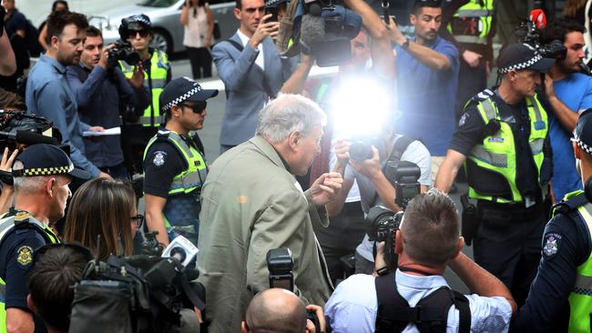 Cardinal George Pell walks along a street in Melbourne. Picture: AFP 