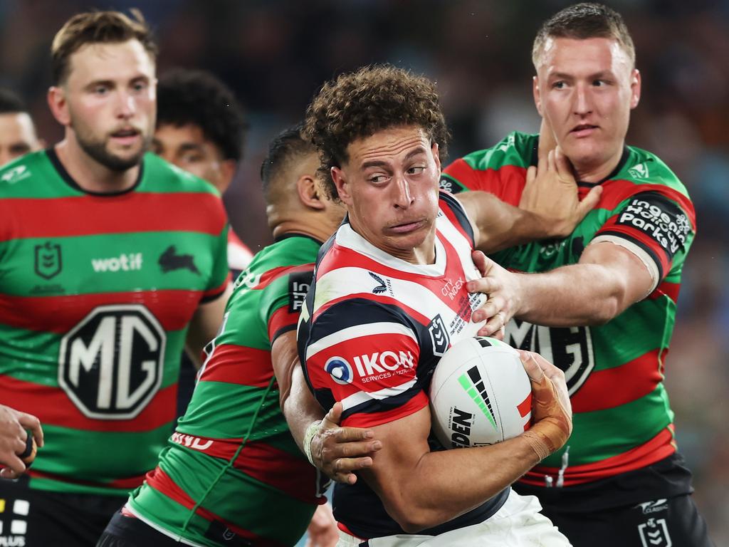 SYDNEY, AUSTRALIA - SEPTEMBER 06: Mark Nawaqanitawase of the Roosters is tackled during the round 27 NRL match between South Sydney Rabbitohs and Sydney Roosters at Accor Stadium, on September 06, 2024, in Sydney, Australia. (Photo by Matt King/Getty Images)