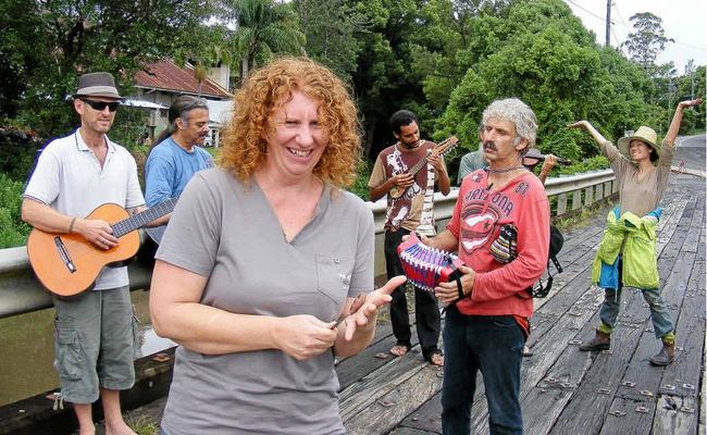 Getting ready to Occupy Nimbin Bridge, is organiser Belinda Marsh at the front with some of the musicians and music lovers who want the bridge kept. Picture: Mel McMillan