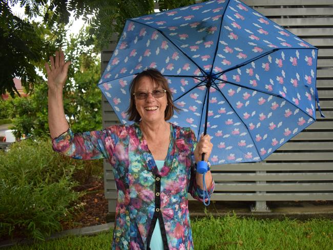 Joanne Scott was over the moon when it poured down in the Gympie CBD yesterday afternoon producing some much needed rain in the empty dams. Photo: Philippe Coquerand