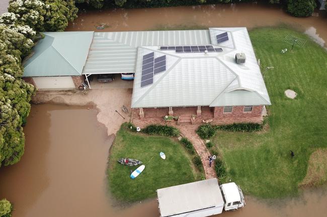 An aerial shot of Gary Tomlinson's home, as floodwaters inch closer to the Forbes property. Picture: Aymon Bertah