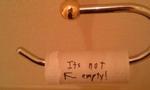 <b>IT'S EMPTY!</b> 
<p>Why replace the empty roll when you could spend more time leaving your wife a note - albeit wrong. The roll is definitely empty, but points for creative procrastination. Fingers crossed it backfired and he was the next person to use the loo.</p>