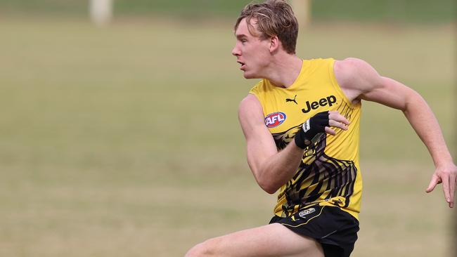 Tom Lynch trains with a glove on his injured hand. Picture: Michael Klein