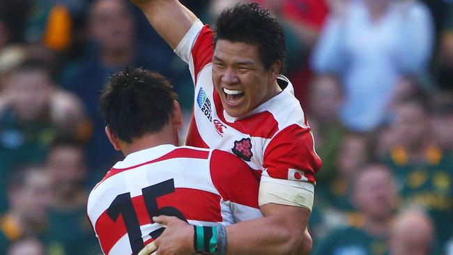 BRIGHTON, ENGLAND - SEPTEMBER 19: Ayumu Goromaru of Japan celebrates with Harumichi Tatekawa of Japan following victory in the 2015 Rugby World Cup Pool B match between South Africa and Japan at the Brighton Community Stadium on September 19, 2015 in Brighton, United Kingdom. (Photo by Charlie Crowhurst/Getty Images) *** BESTPIX ***