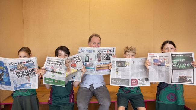 Squiz Kids founding member Bryce Corbett with Canon Hill State School students, teaching them about media literacy. Picture: David Kelly