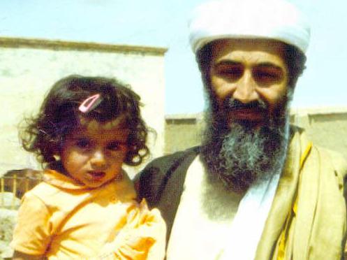 Undated photograph of Saudi millionaire fundamentalist suspected terrorist Osama bin Laden with his daughter in an al-Qaeda training compound at Kandahar in Afghanistan. child family