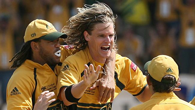 Andrew Symonds (left) and Adam Gilchrist (right) congratulate Nathan Bracken after the dismissal of South African captain Graeme Smith during the semi-final of the 2007 World Cup, St Lucia.