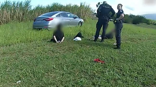 Lina Marie Daley in handcuffs by the side of the road at Yorkeys Knob on Tuesday. Picture: Queensland Police