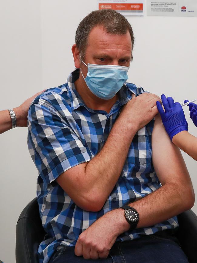 Disability support resident Brett Rasmussen was the third person in line to get the jab. Picture:Justin Lloyd