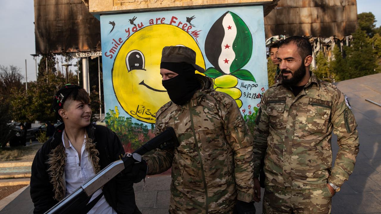 Opposition fighters in Aleppo, the first major city to fall in last week's lightning offensive by rebel forces as they toppled Syria's Assad regime. Picture: Burak Kara/Getty Images