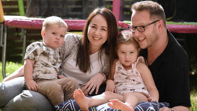 Crystal and Mark Henderson with Archie, 2, and Lily, 4, at home in Varsity Lakes on the Gold Coast. Picture: Lyndon Mechielsen