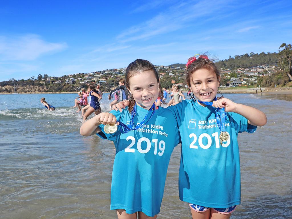 Cousins, Sophie Fellowes (left) and Charli Aorangi both 7 were participants competing in the Bupa KidFit Series triathlon at Blackmans Bay Beach. Picture: LUKE BOWDEN