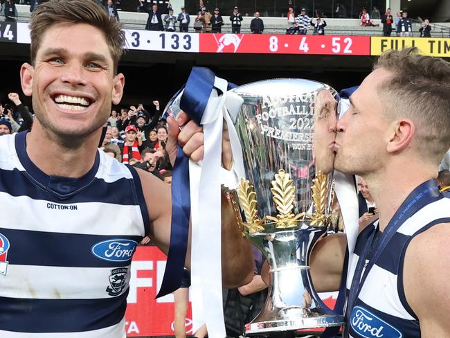 2022 AFL Grand Final between the Geelong Cats and Sydney Swans at the MCG. Victorious Cats players Tom Hawkins and Captain Joel Selwood hold up the Premiership Cup.                    Picture: David Caird