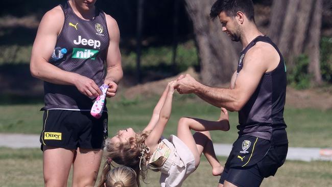 Richmond training on the Gold Coast. 14/07/2020.  Trent Cotchin with his oldest daughter Harper as wife Brooke  looks on at training today   . Pic: Michael Klein