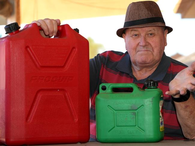 Michael Dunn with two petrol containers, a 20 litre and a 5 litre, re story that he filled them but instead of being charged for 25 litres he was charged for almost 30 litres. Advertiser has since found many pumps are shortchanging customers. He is not happy about being ripped-off. 20 February 2025. Picture: Dean Martin