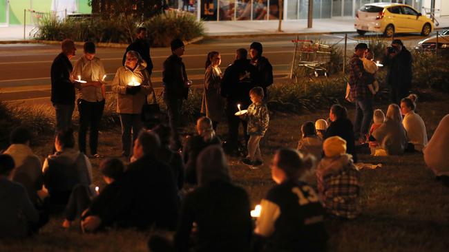 A candlelight vigil outside the Coles shopping centre at Nambour. Picture: AAP Image/Josh Woning