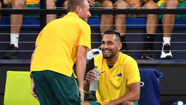 Nick Kyrgios shares a laugh with team captain Lleyton Hewitt. Picture: Getty Images