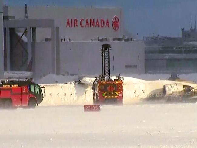 This image taken from video provided by CTV shows emergency crews responding at Toronto Pearson Airport after the Delta Air Lines plane crashed. Picture: CTV via AP