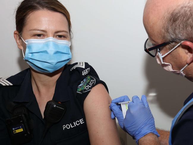 ADELAIDE, AUSTRALIA - NewsWire Photos FEBRUARY 22 Friday, 2021:  ADELAIDE, AUSTRALIA - NewsWire Photos FEBRUARY 22 Friday, 2021: South Australia Police Officer, Amanda Kuchel receives her first injection of COVID-19 Vaccine in South Australia administered by Nurse Craig Robinson at the COVID-19 Clinic on Level 3, The Royal Adelaide Hospital, SA.Picture: NCA NewsWire / Emma Brasier