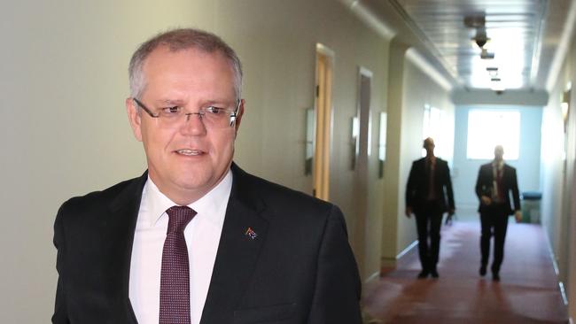 Treasurer Scott Morrison walks to Ch9 studios at Parliament House in Canberra this morning to be interviewed by Laurie Oaks. Picture: Ray Strange.