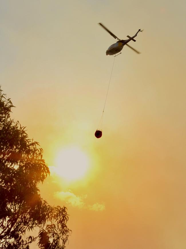 Water bombing helicopters at Noosa North Shore and Cooroibah. Picture: Jacob Friend