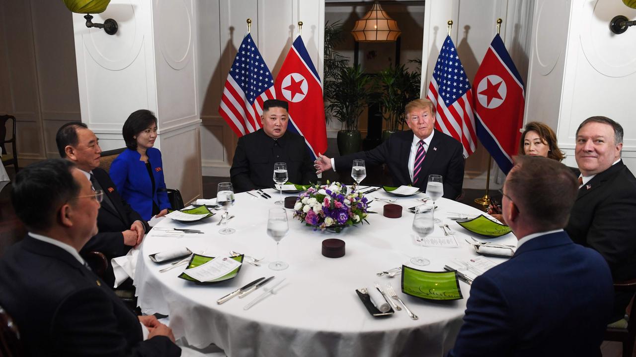 US President Donald Trump and North Korea's leader Kim Jong Un sit with others for a dinner at the Sofitel Legend Metropole hotel in Hanoi. Picture: Saul LOEB / AFP