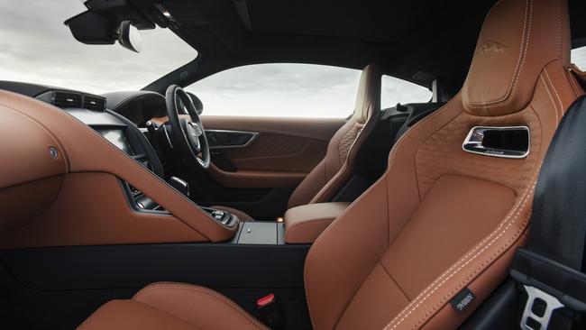 Lashings of double-stitched leather, graphite and central air vents which rise from the dash with a sense of enchantment.