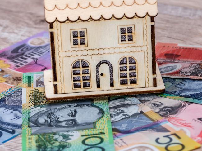 House model with australian dollar banknotes on table, generic money housing