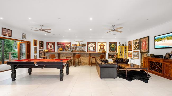 The man cave is used to showcase Corey Parker’s sporting memorabilia.