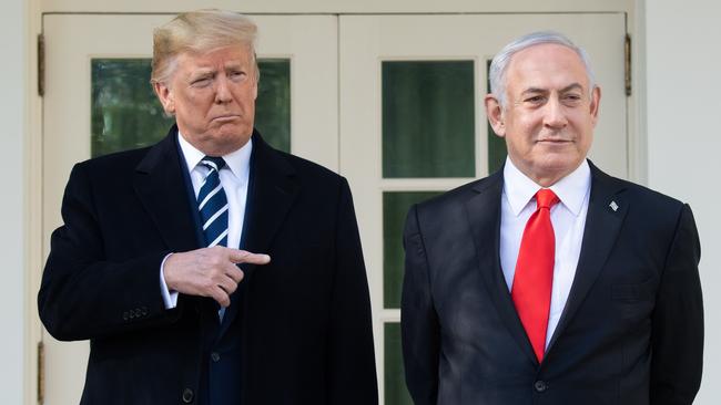 Donald Trump and Benjamin Netanyahu speak to the press on the West Wing Colonnade prior to meetings at the White House in Washington.