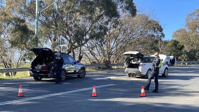 Police direct traffic around the scene of a two car collision on Nepean Hwy in Mount Martha. Picture: Lucy Callander