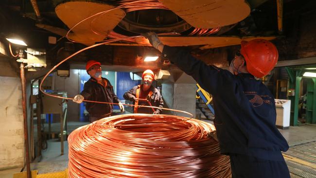 Workers coil copper wire rod at a refinery in Russia. Picture: Bloomberg