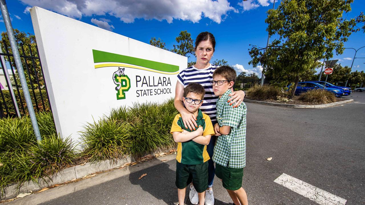 Mandi Tran with her children Oliver, 10, and Grayson, 8, outside Pallara State School. Picture: Nigel Hallett