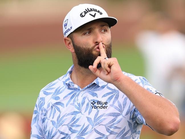 DUBAI, UNITED ARAB EMIRATES - NOVEMBER 18: Jon Rahm of Spain gestures with his hand to his mouth on course during Day Three of the DP World Tour Championship on the Earth Course at Jumeirah Golf Estates on November 18, 2023 in Dubai, United Arab Emirates. (Photo by Andrew Redington/Getty Images)