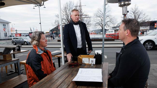 Rockliff chatting with tourists at a cafe on Hobart’s waterfront. Picture: Peter Mathew