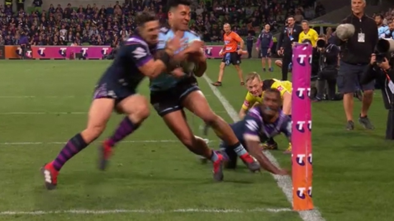 Billy Slater shoulder charges Sosaia Feki of the Sharks to stop him from scoring a try in 2018. Pic: FOXSPORTS