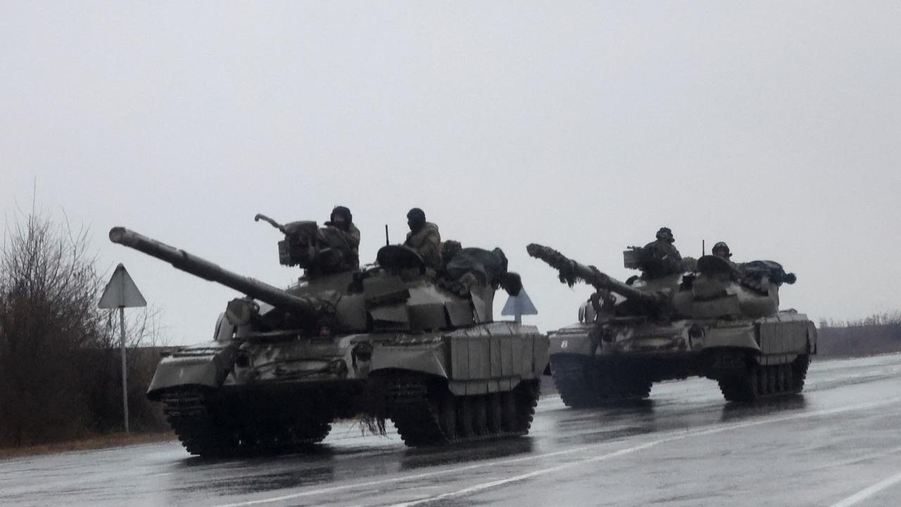 Tanks move into the city, after Russian President Vladimir Putin authorised a military operation in eastern Ukraine, in Mariupol. Picture: Reuters/Carlos Barria