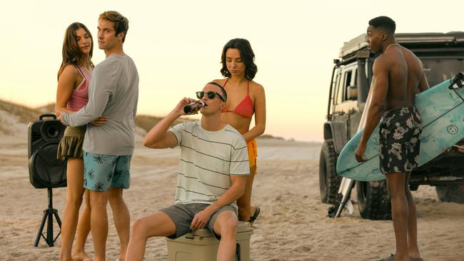 Drew Starkey plays Rafe (centre) in Outer Banks. Picture: Jackson Lee Davis/Netflix