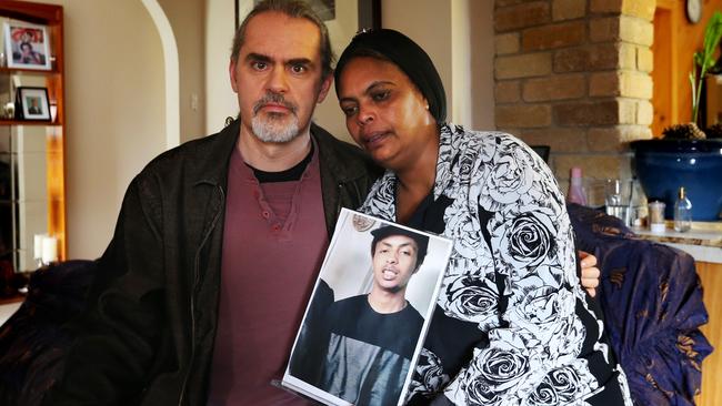 Naz’s stepfather Darron Darron Lehmann and mother Hirut Woldemicheal Seboka with a recent picture of their missing son. Picture: NIKKI DAVIS-JONES