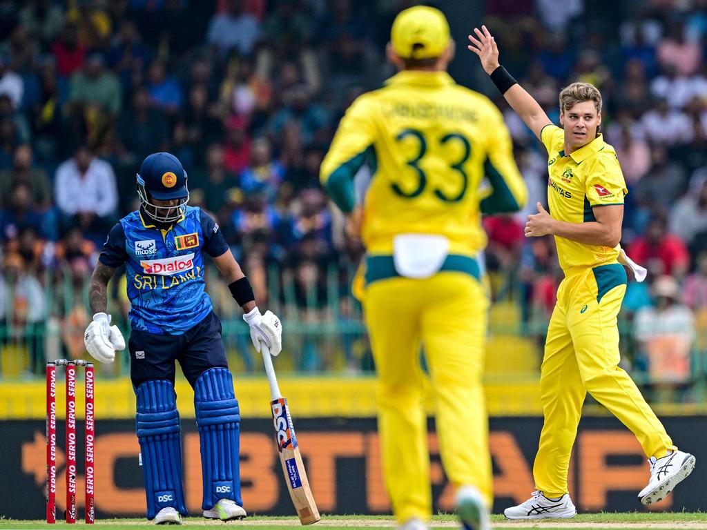 Australia's Spencer Johnson (R) celebrates after taking the wicket of Sri Lanka's Pathum Nissanka. Picture: AFP