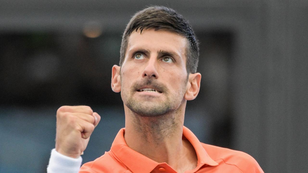 Serbia's Novak Djokovic celebrates his victory against France's Quentin Halys during their men's singles match at the Adelaide International tennis tournament in Adelaide on January 5, 2023. (Photo by Brenton EDWARDS / AFP) / - IMAGE RESTRICTED TO EDITORIAL USE - STRICTLY NO COMMERCIAL USE-