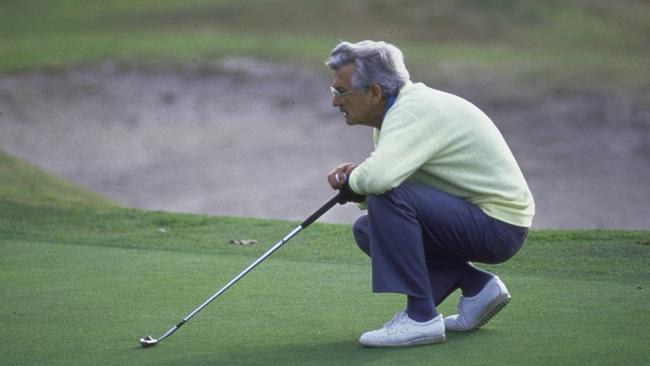 Australian Prime Minister Robert Hawke, on a golf course with his club. (Photo by James Pozarik/The LIFE Images Collection/Getty Images)