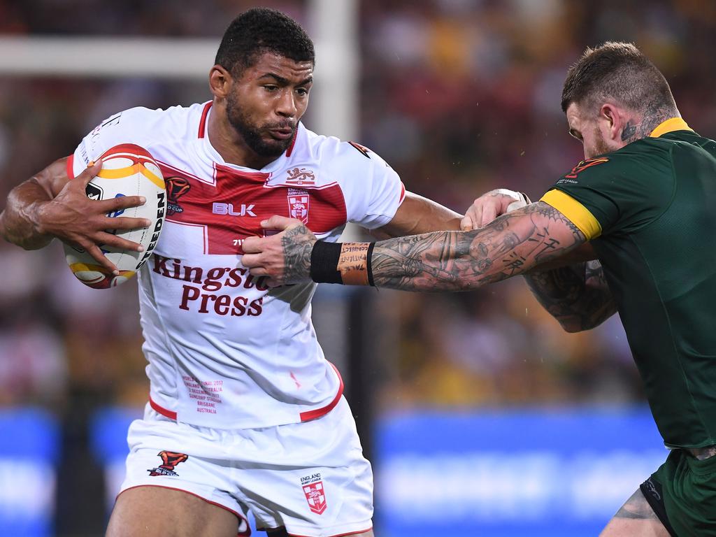 BRISBANE, AUSTRALIA - DECEMBER 02:  Kallum Watkins of England is tackled during the 2017 Rugby League World Cup Final between the Australian Kangaroos and England at Suncorp Stadium on December 2, 2017 in Brisbane, Australia.  (Photo by Bradley Kanaris/Getty Images)