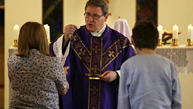 Father Sam Lynch during mass at St Patrick’s. Picture: Adam Yip