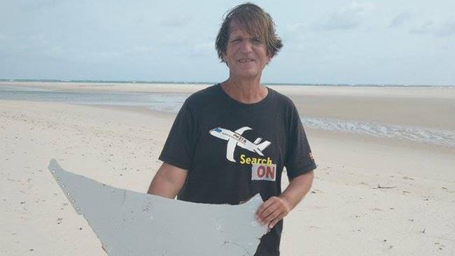 Self-funded MH370 investigator and blogger Blaine Gibson poses with what he believes could be a piece of the missing plane in Mozambique.