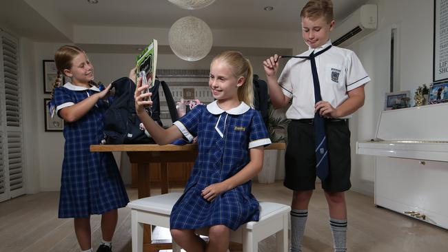 Jessica, 9, Sarah, 11, and Lachlan, 14, are getting ready for the new school year. Picture Glenn Hampson