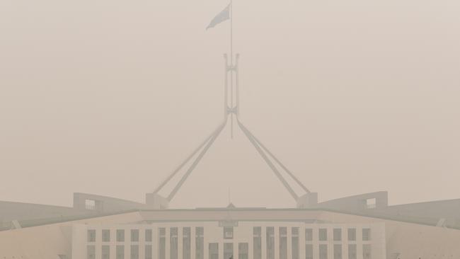 Parliament House is shrouded in a thick smoke haze. Picture: AAP.