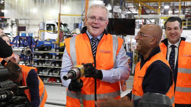 Scott Morrison with workers at the PACCAR Australia plant in Bayswater, Melbourne, on Wednesday. Picture: David Crosling