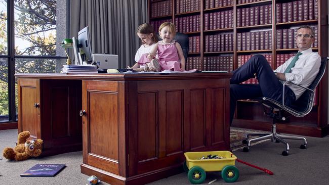 ‘Crime does not stop at the border’ … NSW Premier Dominic Perrottet in his office at Parliament House in Sydney with daughters Amelia, 11, and Beatrice, 3. Picture: James Horan