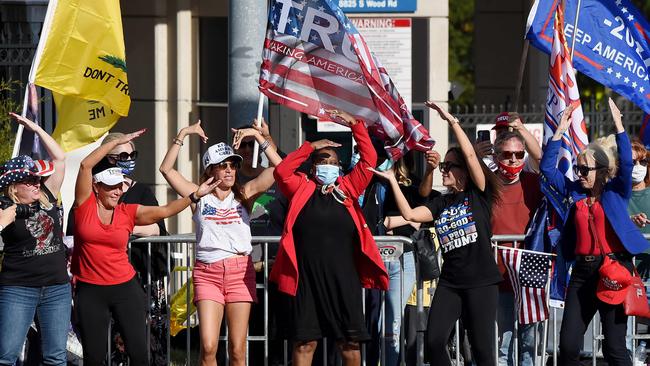 TOPSHOT - Supporters of US President Donald Trump gather outside Walter Reed National Military Medical Center. Picture: Olivier Douliery/AFP